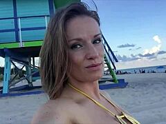 Bikini-clad Jillian shows off her ample assets on the beach