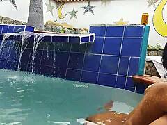 Indian mature and young Brazilian couple in the pool