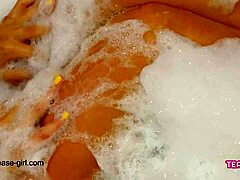 Seductive teen indulges in a sensual bath